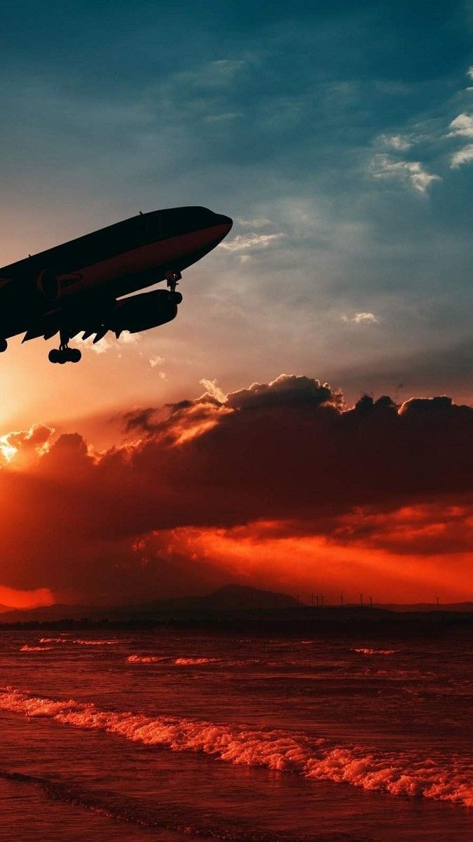 Aereo silhouette al tramonto sul mare, 675x1200 Verticale, Telefono