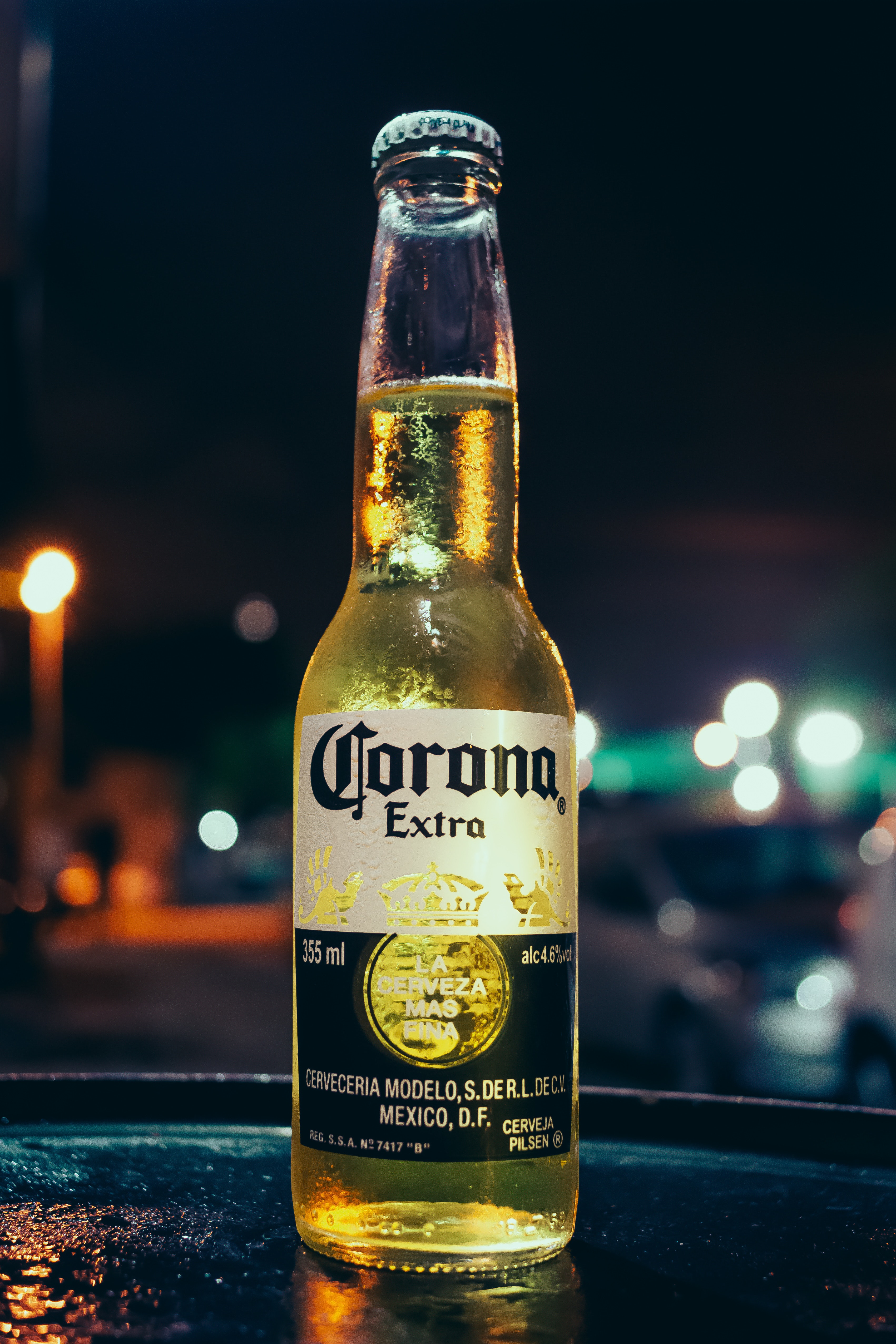 Bottiglia Corona Extra notturna, 3403x5104 Verticale, Mobile