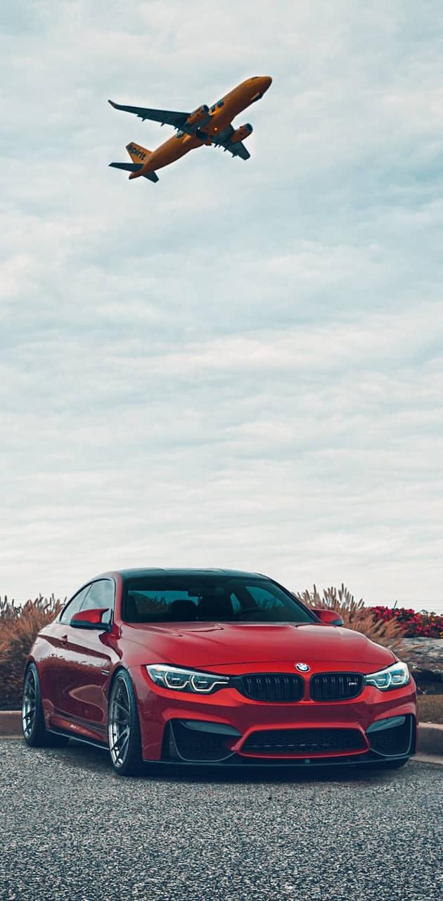 BMW M4 rossa aereo cielo, 630x1280 Verticale, Telefono