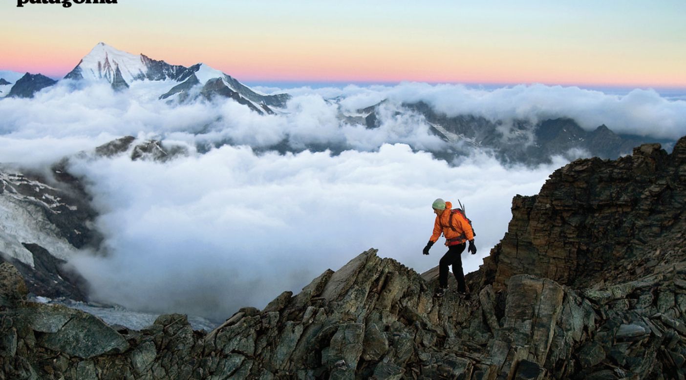 Alpinista su cresta rocciosa nuvole, 1404x778 HD, Desktop