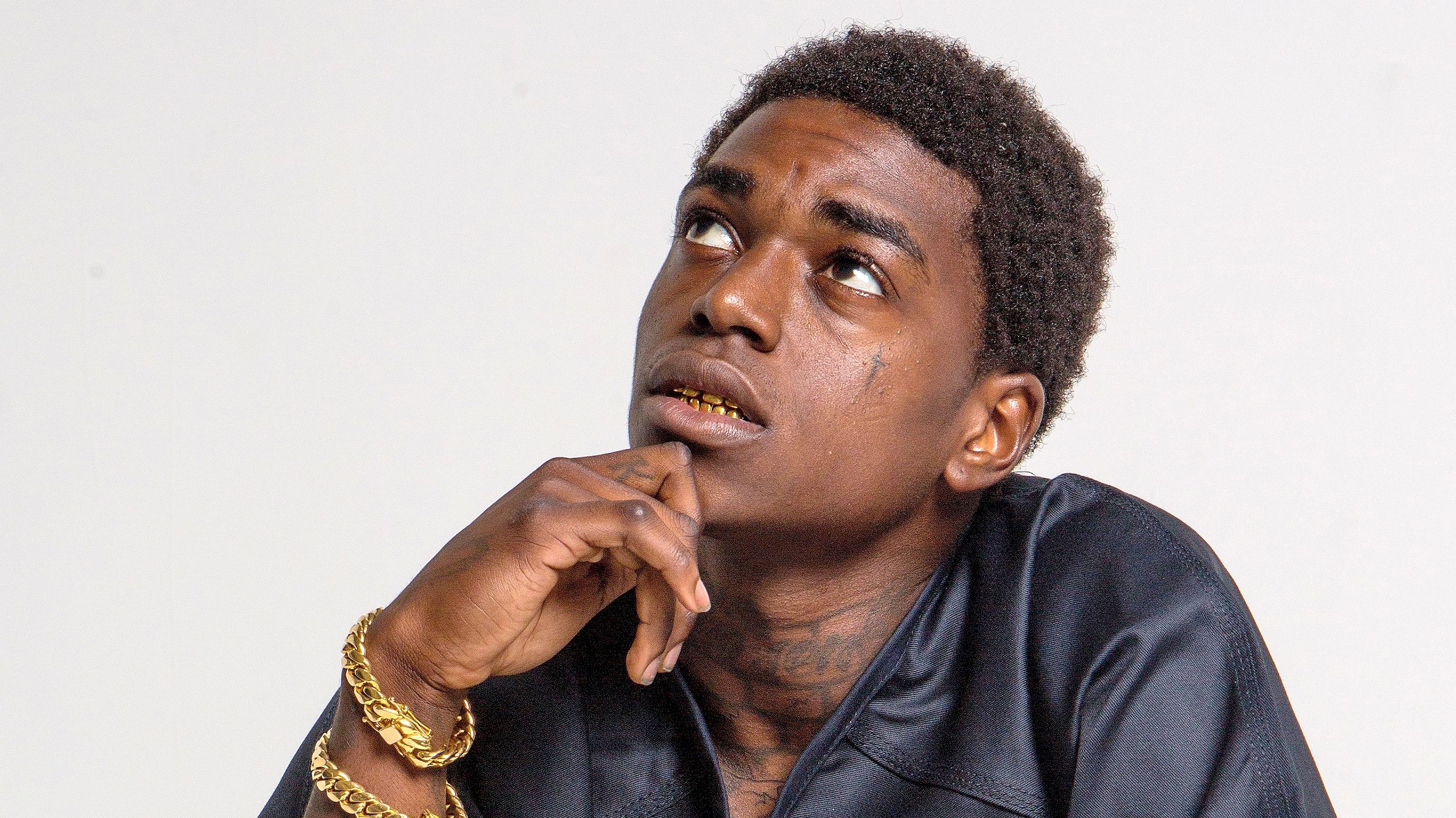 Kodak Black ritratto pensieroso, 2552x1434 2K, Laptop