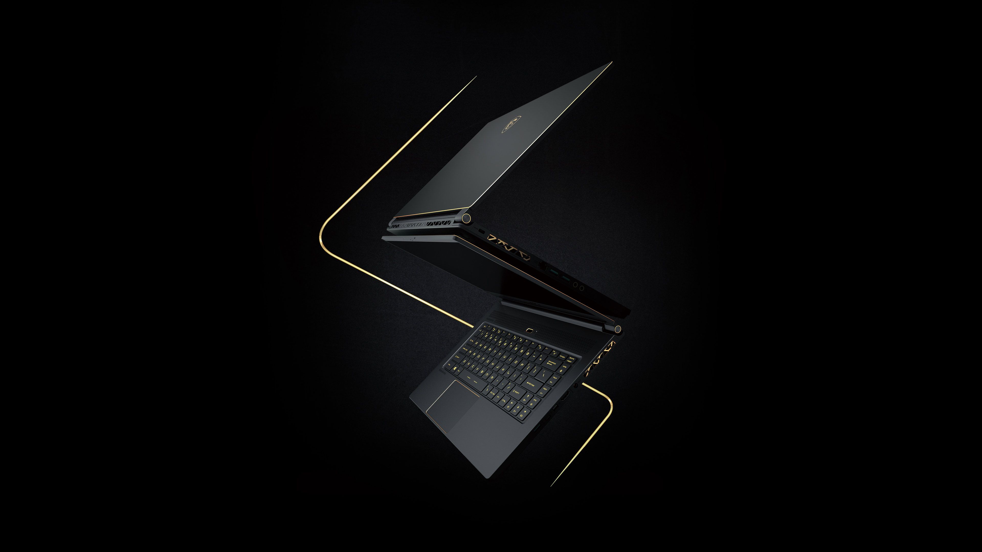 Laptop MSI nero su sfondo scuro, 3840x2160 Ultra HD, 4K TV