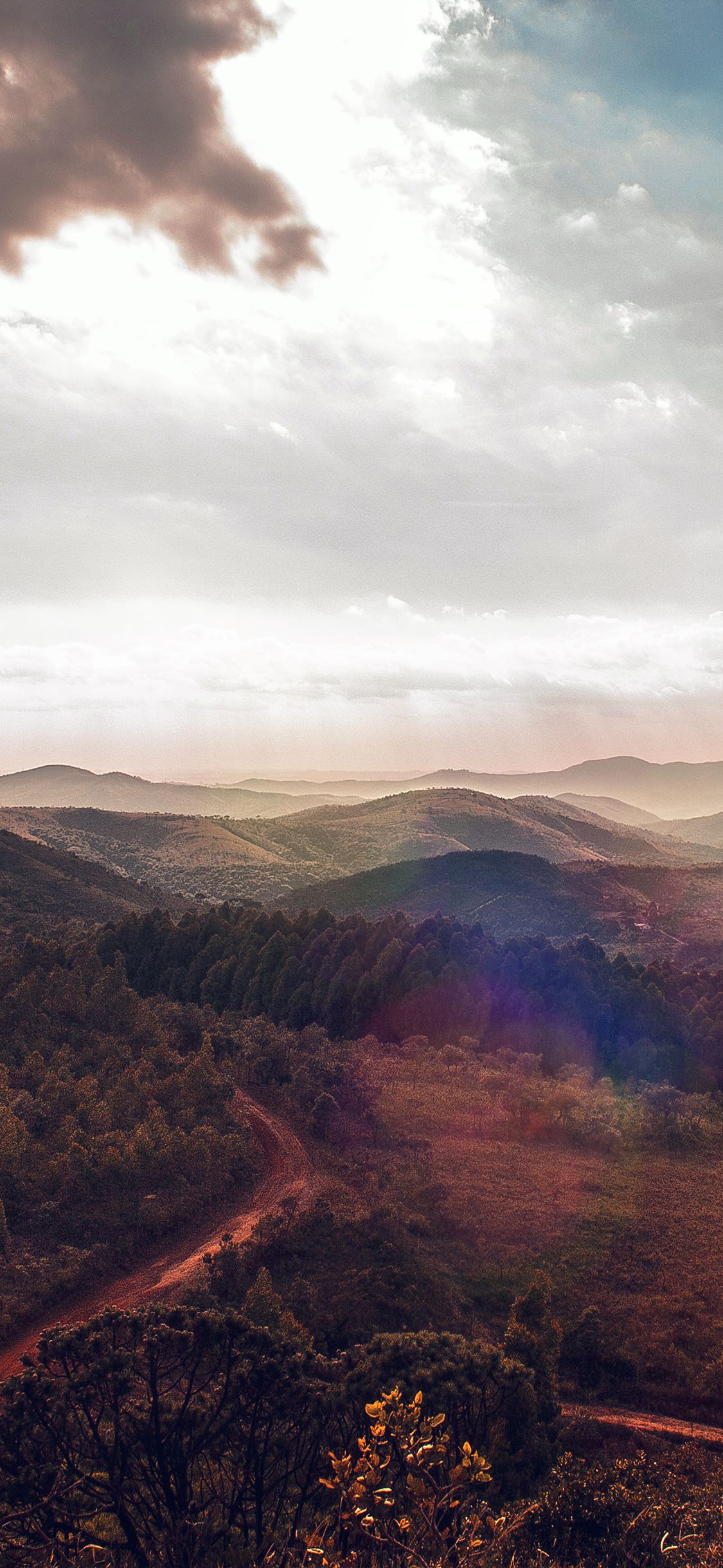 Colline e foresta al tramonto, 1125x2436 Verticale, iPhone Air