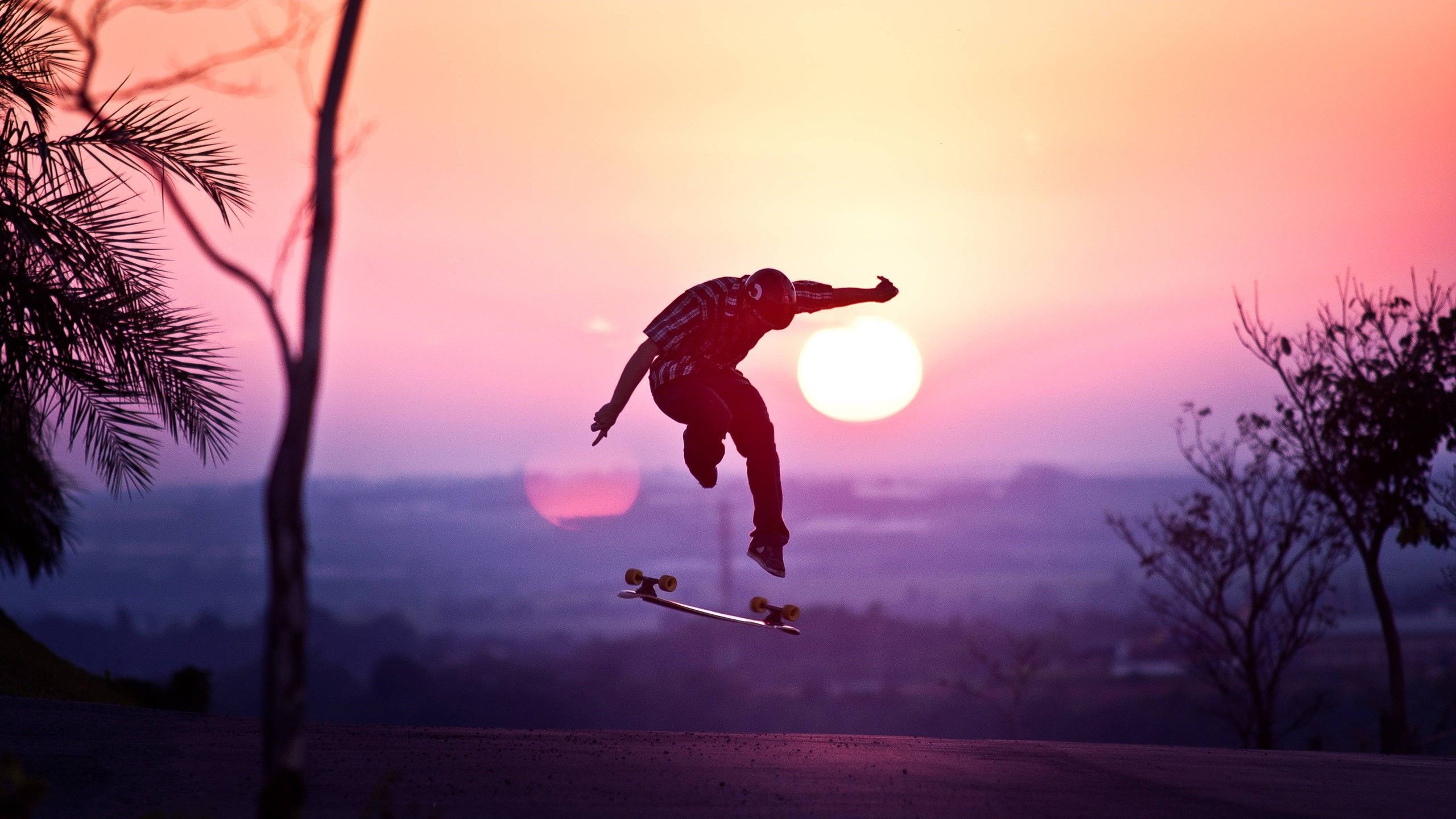 Skateboarder salto al tramonto, 2560x1440 1440p, Desktop