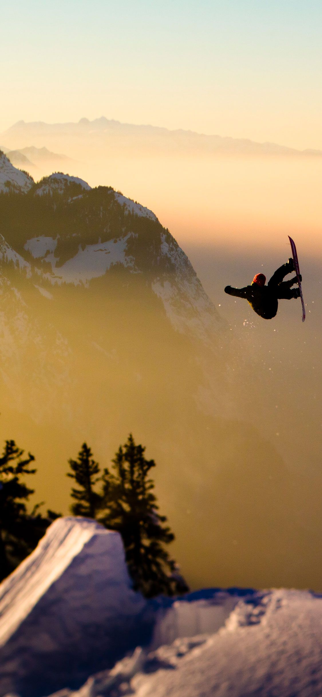 Snowboarder salto al tramonto, 1125x2436 Verticale, Mobile