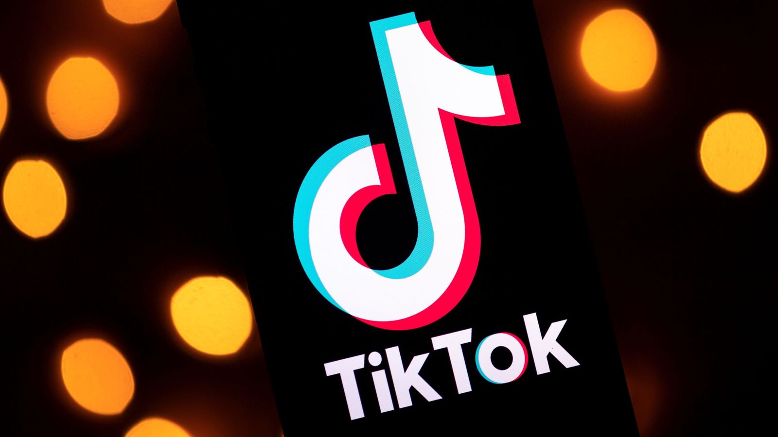 Logo TikTok su smartphone, 1600x900 HD Ready, Desktop